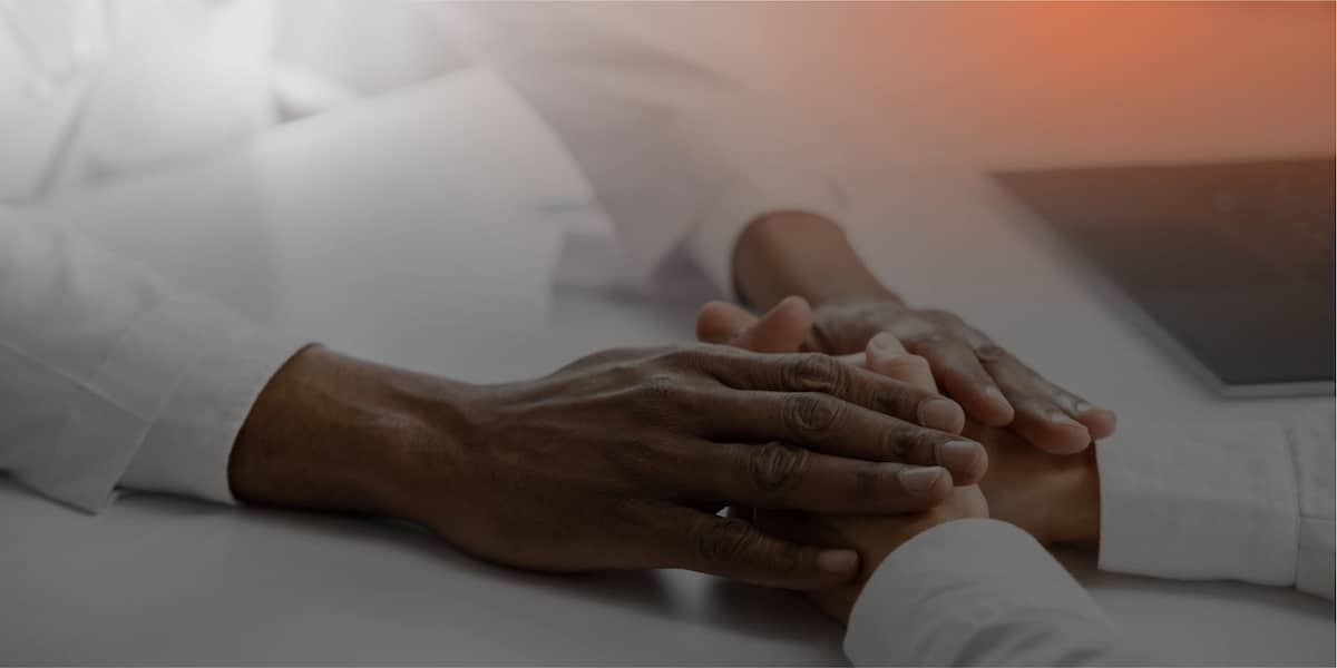 consoling-another-persons-hands-after-a-tragic-event