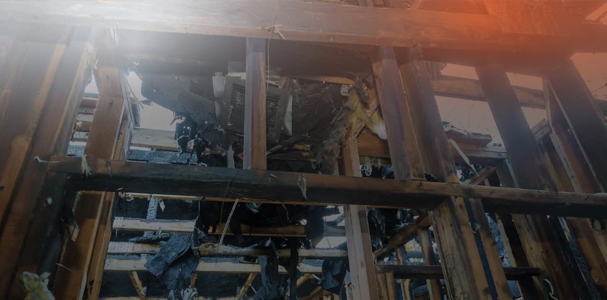 fire-damage-to-a-house-with-its-wood-badly-charred-and-most-of-the-house-torn-down