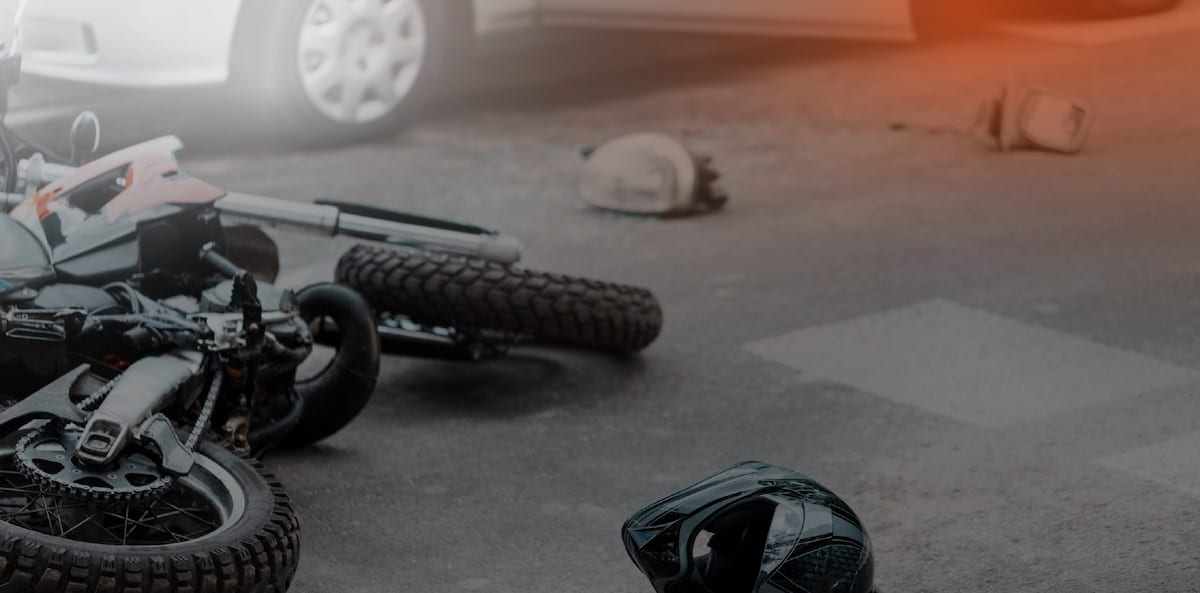 motorcycle-accident-on-the-street-with-car-and-motorcycle-parts-everywhere