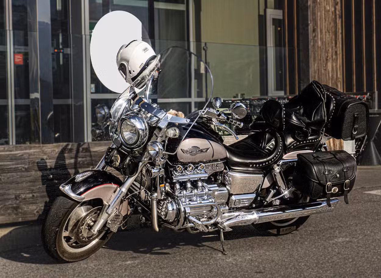 motorcycle parked in front of a hospital